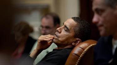 President Obama reflects during an economic meeting with advisors in the Roosevelt Room. He is seated between Senior Advisor David Axelrod and Chief of Staff Rahm Emanuel , right. 3/15/09. Official White House Photo by Pete Souza